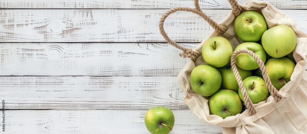 Poster eco friendly bag with green apples on white wooden backdrop showcasing sustainable living with zero 