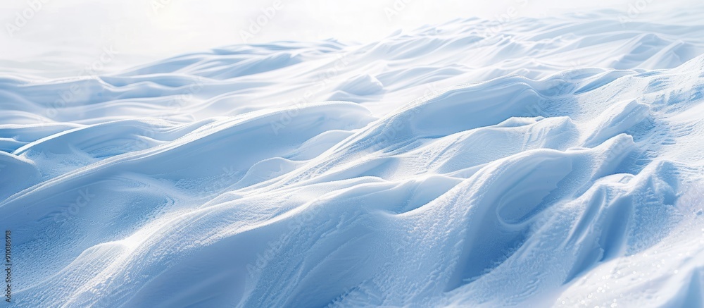 Poster Winter scene with snowy ground and patterns shaped by wind on the snow surface ideal as a copy space image