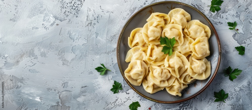 Poster russian style pelmeni ravioli and dumplings with meat on a plate with a light concrete background su
