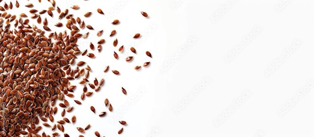 Poster Flax seeds scattered on the edge of a frame on white backdrop with copy space image