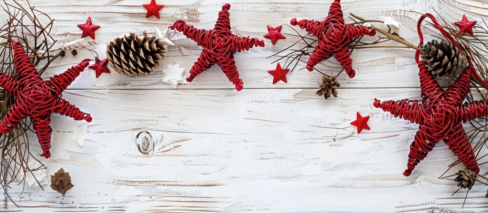 Leinwandbilder a festive christmas scene featuring red rattan stars cones and a white wooden backdrop ideal for a g
