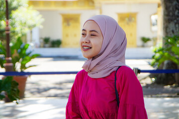 Asian Indonesian muslim tourist woman traveling inside kraton Yogyakarta sultanate palace