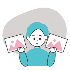 画像を選んでいる男性のイラスト