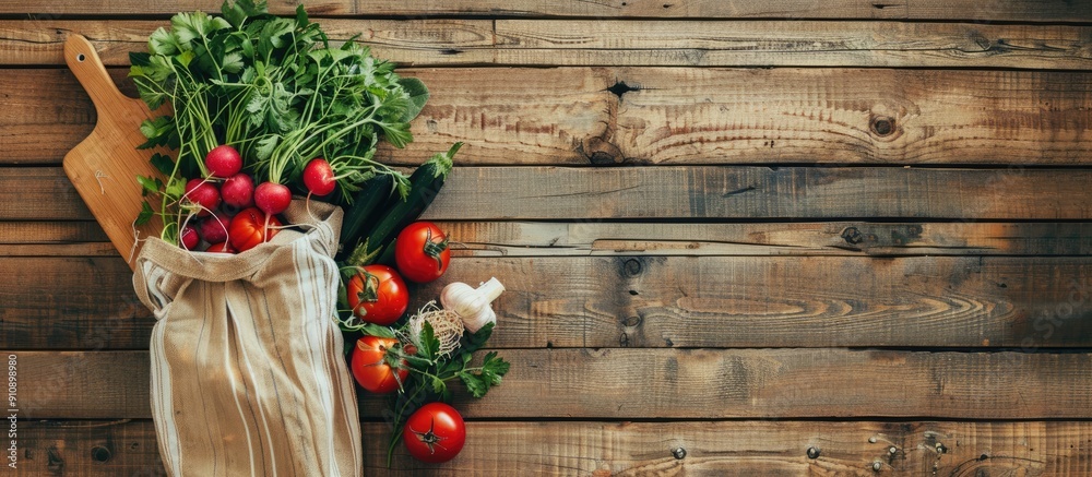 Poster fresh vegetables in a reusable shopping bag from a grocery farm shop beside a chopping board on a vi