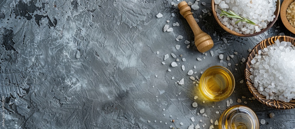 Poster a spa set featuring mineral salt and oil placed on a grey background with ample copy space image ava