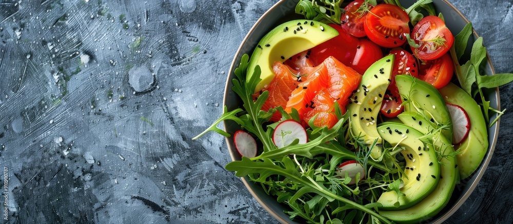 Poster top view of a salad bowl containing fresh vegetables like tomatoes avocado arugula seeds and salmon 