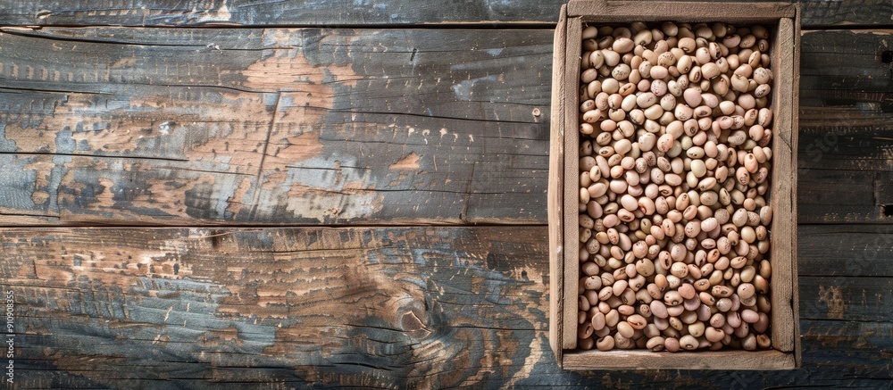 Aufkleber free copy space image of uncooked beans arranged in a top view inside a wooden box