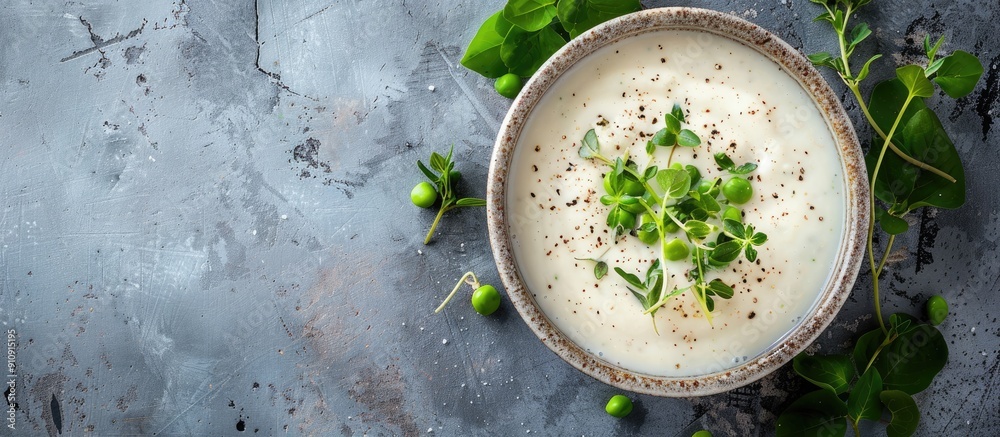 Aufkleber Top view of a summer cream soup with green fresh pea shoots with empty space for text on a copy space image