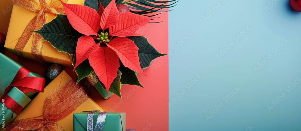 Poster A festive scene with a poinsettia flower and New Year s gifts arranged on a colorful background creating a perfect copy space image