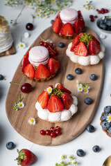 Berry Desserts Assortment, Seasonal Pastry over Bright Background
