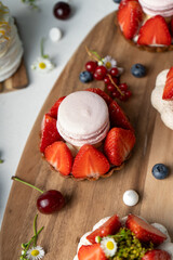 Berry Desserts Assortment, Seasonal Pastry over Bright Background
