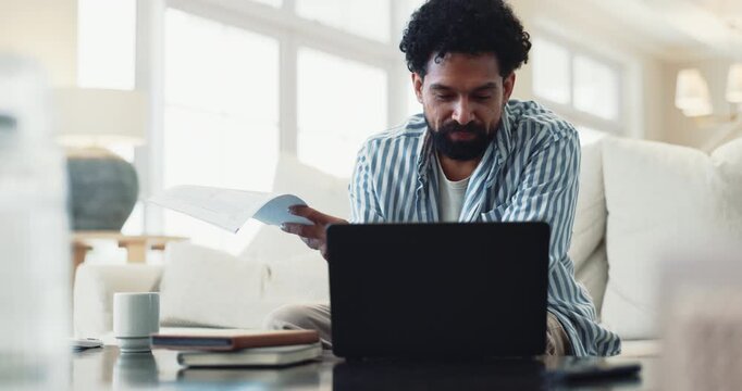 Man, laptop and reading paperwork on sofa for mortgage review, insurance research and bills in home. Guy, computer and check documents with asset management, tax registration and budget spreadsheet
