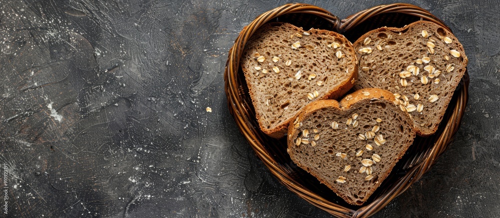 Poster heart shaped basket with organic wholemeal bread slices incorporating oats and flax seeds for a heal