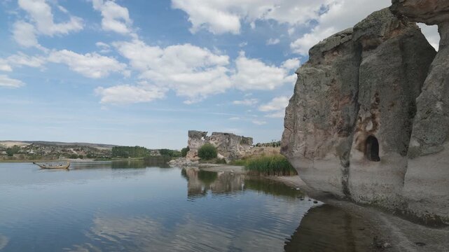 The interesting nature of Lake Emre in the Phrygian valley. Lake boat tour. Historical rock houses. 4k video 