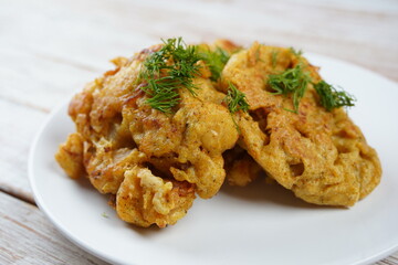 Fried fish in a batter on a plate