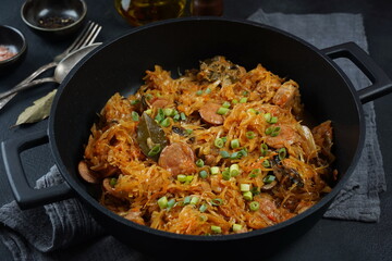 Bigos - traditional Polish dish of chopped meat stewed with sauerkraut and shredded fresh cabbage