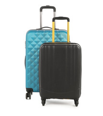 Two new light blue and black suitcases isolated on white