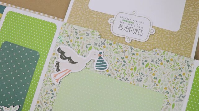 Stork carrying a sweet baby in a bag, for a baby scrapbook
