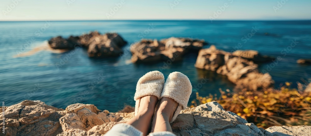 Poster legs wearing slippers by the seaside with a scenic background perfect for copy space image