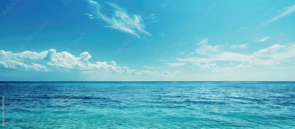 Poster scenic view of the sea and sky meeting at the horizon with a clear blue color palette in the copy sp