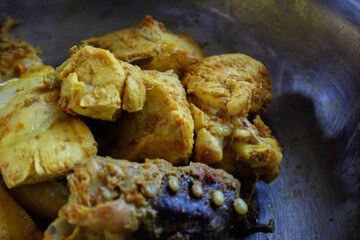 Boiled chicken with yellow color on the small basin