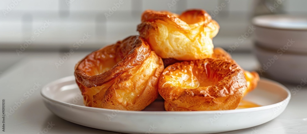 Aufkleber yorkshire pudding on a plate with a light tile background creating a pleasing copy space image