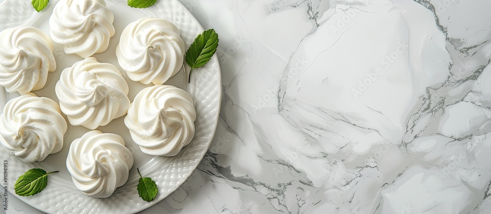 Poster Top view of a white marble table with a tray of delicious meringue cookies Ideal for adding text with copy space image