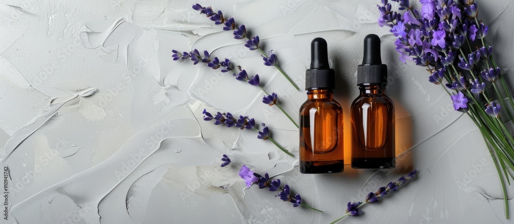 Poster top down view showcasing two unbranded cosmetic serum bottles alongside a fresh lavender bunch on a 