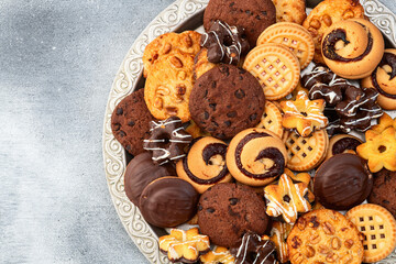 Mix of cookies . Many unhealthy snacks . Top view