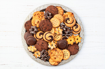 Mix of cookies . Many unhealthy snacks . Top view