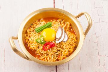  An instant food made by steaming noodles, frying them in oil, and then drying them. Add powdered soup separately.