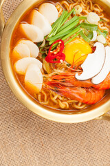  An instant food made by steaming noodles, frying them in oil, and then drying them. Add powdered soup separately.