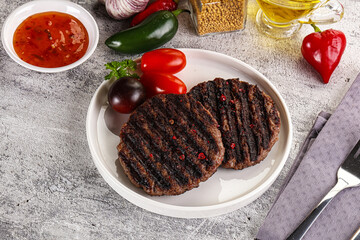 Grilled burger cutlet with sauce