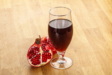 Sweet pomegranate juice in glass