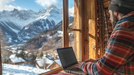 Freelancer typing on a laptop in a cozy mountain cabin with a view of snowy peaks , Digital nomad concept .