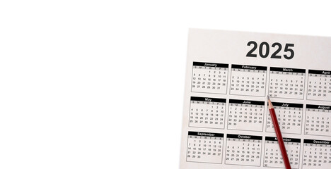 2025 white desk calendar on white background. Close Up Pencil On Calendar 2025. calendar on white...