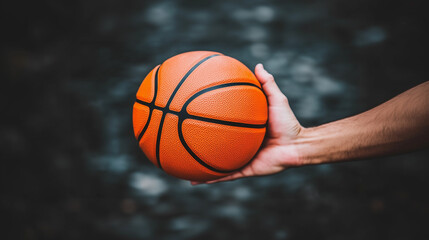 A person is holding a basketball in their hand