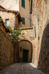 narrow street in a village of Val d'Orcia