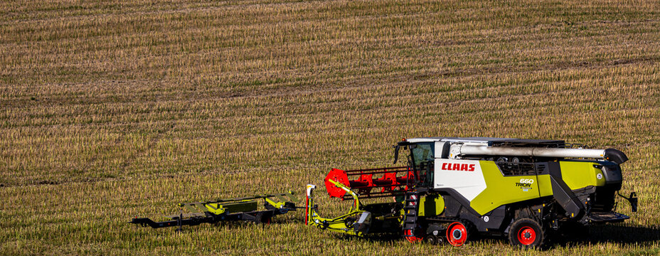 frankenberg, hesse, germany - 30 07 2024: a modern claas harvester on a field