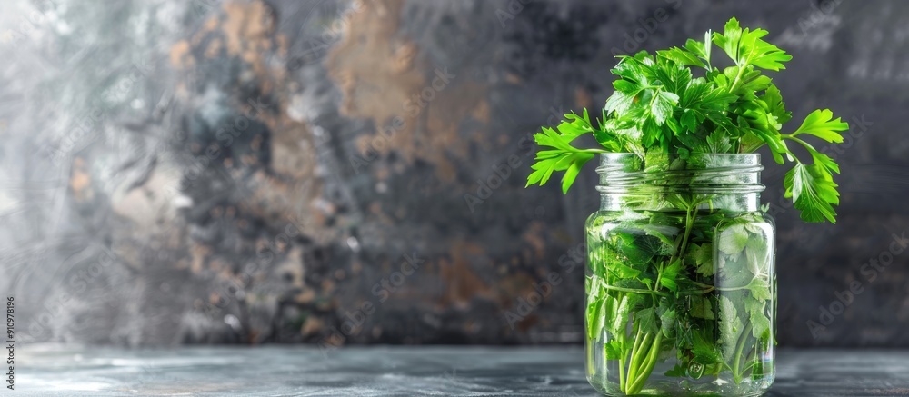 Poster jar with vibrant green parsley on a tabletop providing ample copy space for text