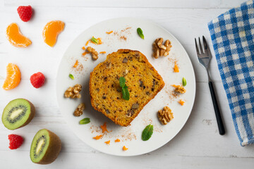 Delicious piece of carrot cake with walnuts.