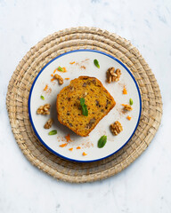 Delicious piece of carrot cake with walnuts.