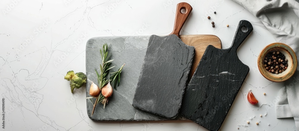 Poster Top view of slate cooking boards on a white surface with space for text ideal for a copy space image mockup