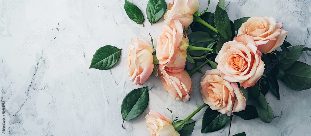 Aufkleber Flat lay scene captured from above featuring a rose bouquet with leaves on a light table providing ample copy space in the image