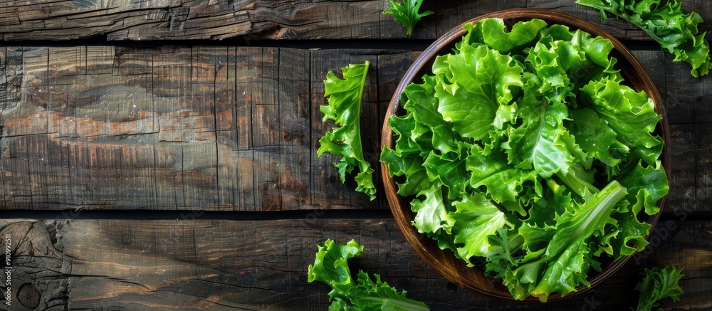 Aufkleber Top down view of a fresh green lettuce salad on a rustic wooden table Ideal for text placement Healthy dietary option with copy space image