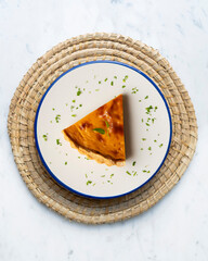 Delicious piece of American pumpkin pie in an overhead view.
