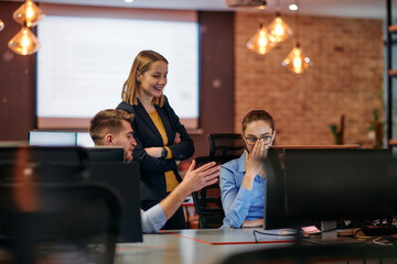 Strategic Business Meeting: Group of Professionals Collaborating in Office Using Computers