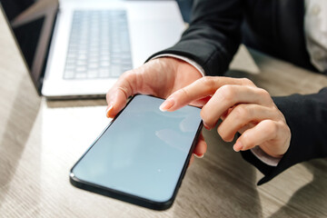 Close-up of female hands pressing on a blank white screen for your advertisement. Perfect for showcasing your brand or promotional content.