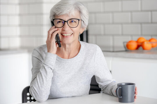 Sweet Senora Talks On Phone In Kitchen