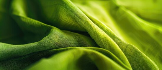 Vibrant green fabric in a detailed close-up shot with copy space image available.